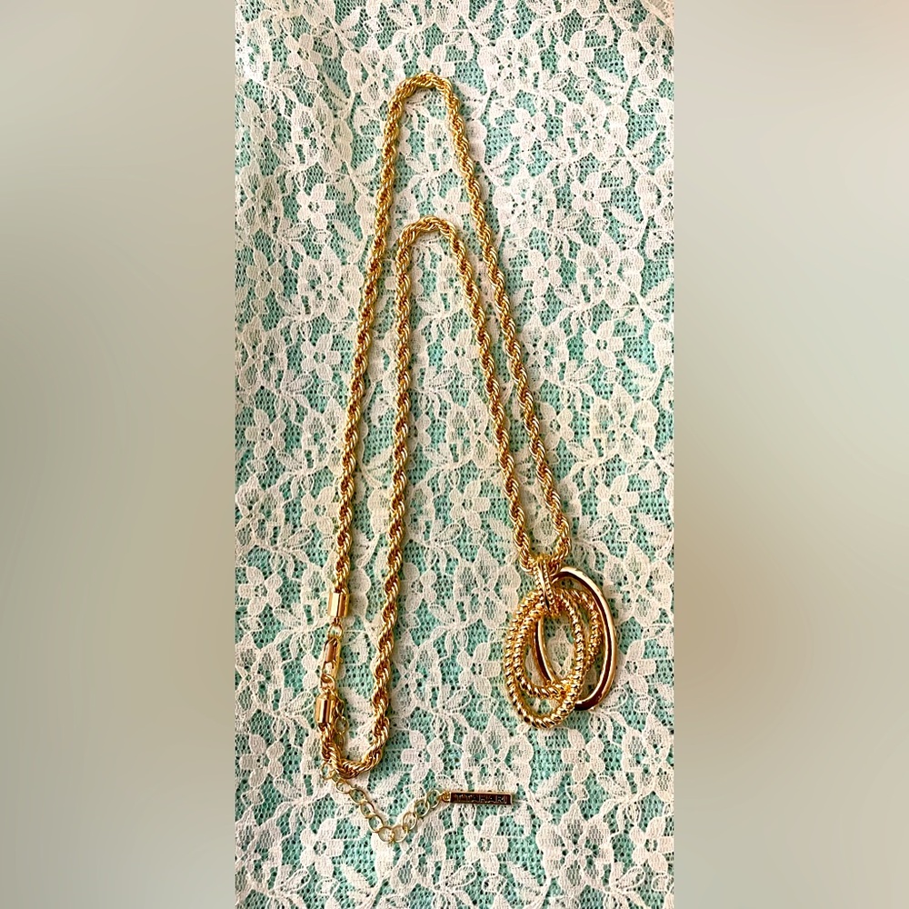 Signed, T Tahari gold tone rope necklace
